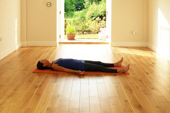 Savasana yoga position - The Coach House studio